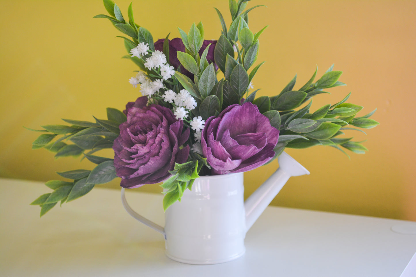 White Watering Can with Purple Flowers