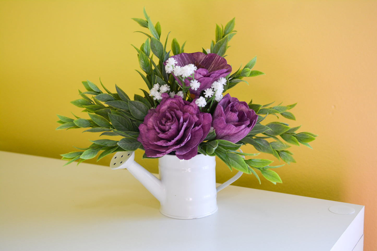 White Watering Can with Purple Flowers